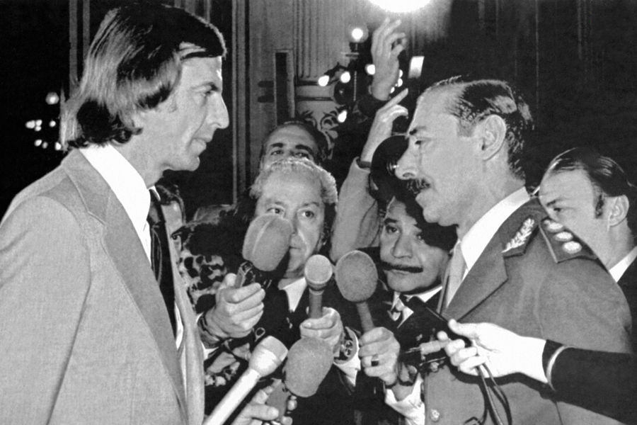 Menotti staring down dictator, General Videla.