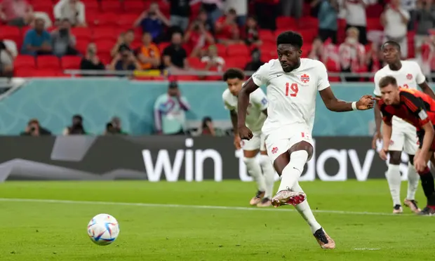 Alphonso Davies of Canada takes a penalty against Belgium in a Group F fixture at the 2022 World Cup in Qatar